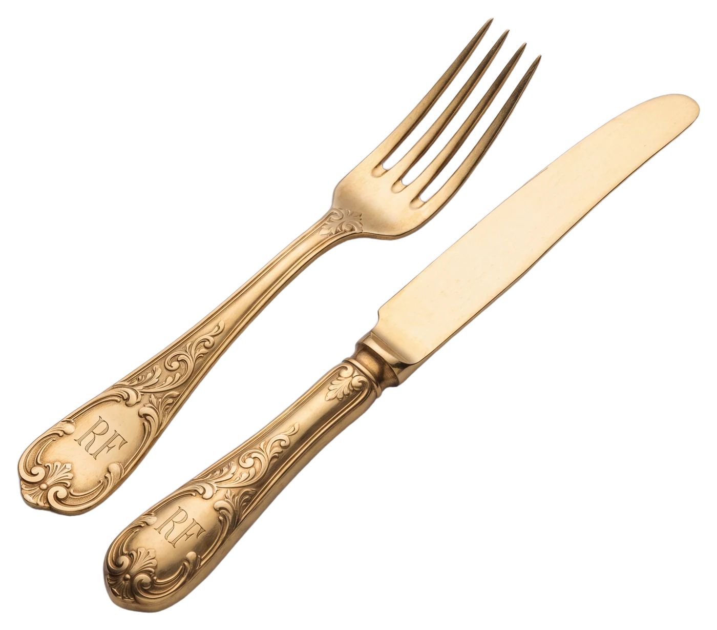An antique-gold fork and knife engraved RF